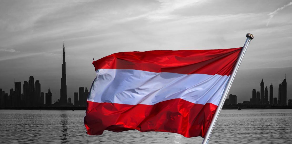 austrian flag over ubai skyline