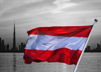 austrian flag over ubai skyline